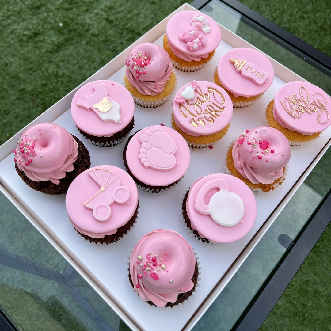 12 PINK CUPCAKES DISPLAYED IN A LUXURY CUPCAKE BOX
