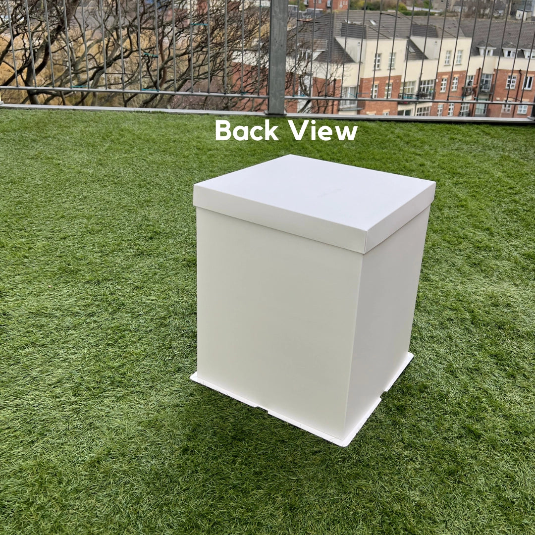 A professional-grade white crystal cake box showing a stable 12-inch base and clear viewing window. Designed for tall cakes to ensure secure delivery and high-end display for bakeries.