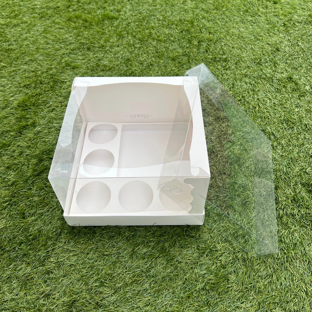 Reinforced bento cake carrier replacing flimsy DIY boxes, featuring precision-cut cupcake slots for secure delivery.